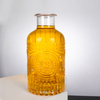 Elaborate Floral - Inspired Glass Liquor Bottle with Thick Neck