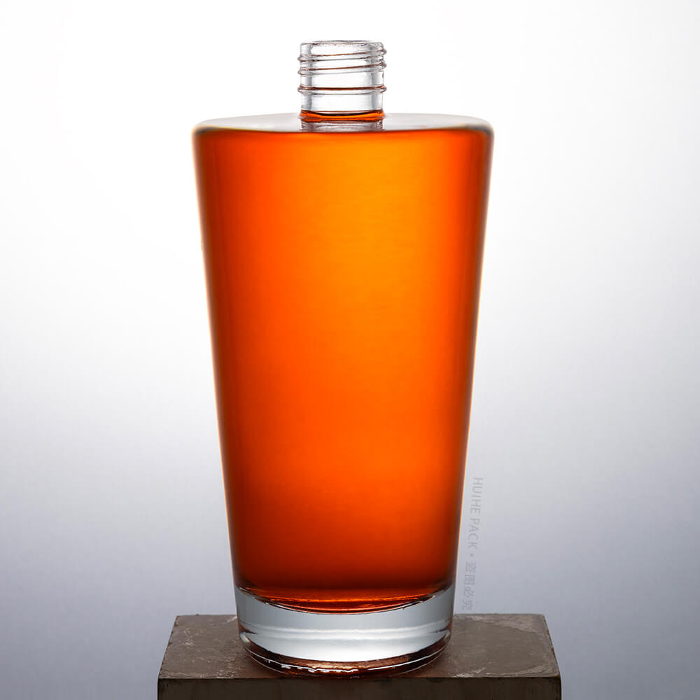 round glass liquor bottle