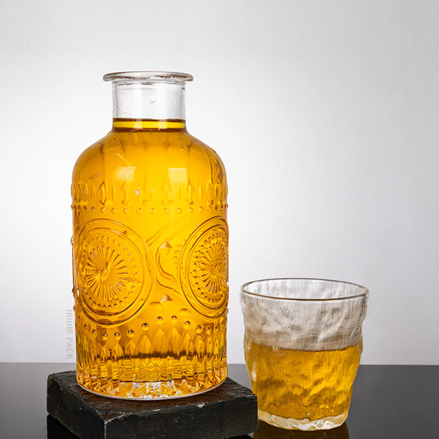 Elaborate Floral - Inspired Glass Liquor Bottle with Thick Neck