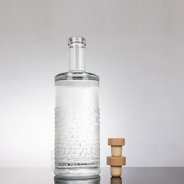 Raised Letters Textured Cylinder Glass Liquor Bottle