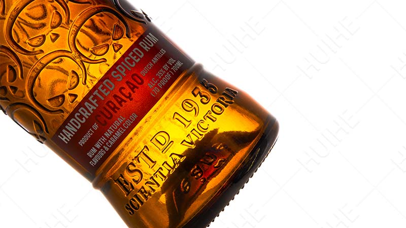 Custom vs Standard Glass Bottles-embossed process amber glass