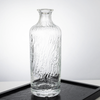 700ml Cylinder Embossed Pattern of Water-﻿Flow Glass Liquor Bottle