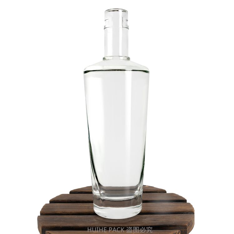 transparent glass liquor bottle