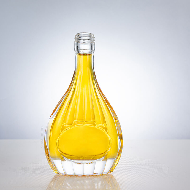 Pear - Shaped Glass Liquor Bottle with Vertical Ribbed Patterns