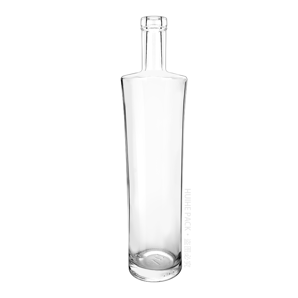 clear glass liquor bottle