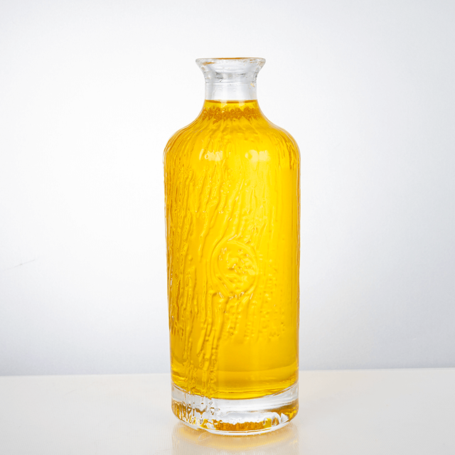 700ml Cylinder Embossed Pattern of Water-﻿Flow Glass Liquor Bottle
