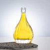 Pear - Shaped Glass Liquor Bottle with Vertical Ribbed Patterns