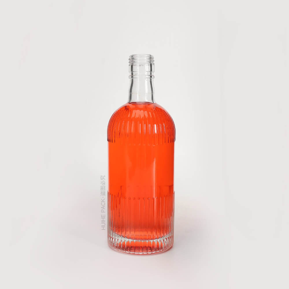 round glass liquor bottle