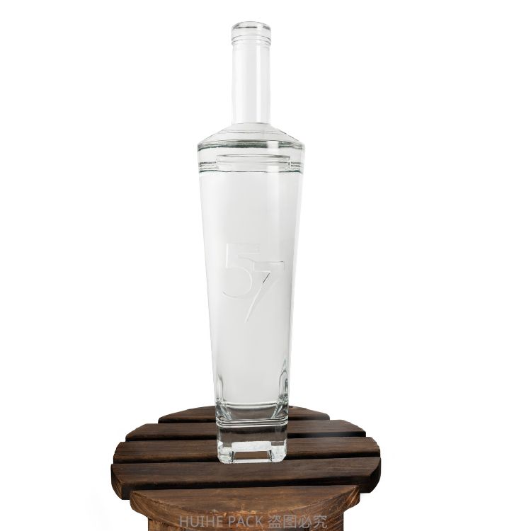 clear glass liquor bottle