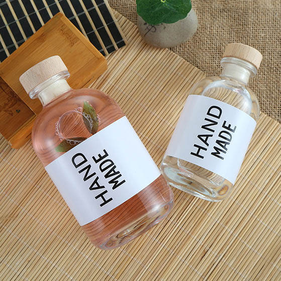 Garrafa de vidro de vinho de frutas redondas transparentes e foscas