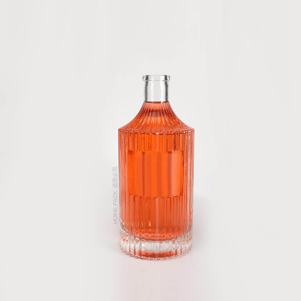 transparent liquor bottle