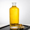 700ml Cylinder Embossed Pattern of Water-﻿Flow Glass Liquor Bottle