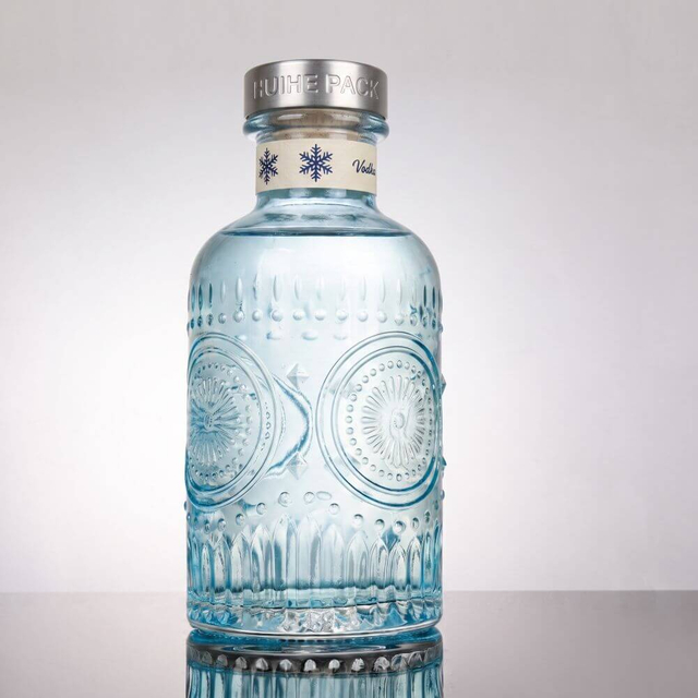 Elaborate Floral - Inspired Glass Liquor Bottle with Thick Neck
